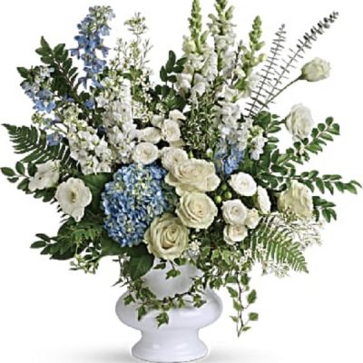 <div class="m-pdp-tabs-description">
<div id="mark-1" class="m-pdp-tabs-marketing-description">A treasured tribute to your beloved, this gorgeously grand bouquet of soft blue hydrangea and pure white roses is reminiscent of a clear sky, a hopeful reminder of life and love.</div>
</div>
<p id="arrngDescp">This beautiful bouquet of light blue hydrangea, white roses, white spray roses, white lisianthus, light blue delphinium, white snapdragons, white stock, and white waxflower is accented with huckleberry, variegated ivy, spiral eucalyptus, dagger fern, and lemon leaf. Delivered in a white designer urn.</p>